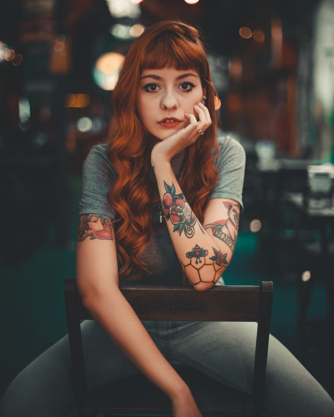 Woman in Gray Shirt Sitting on Chair